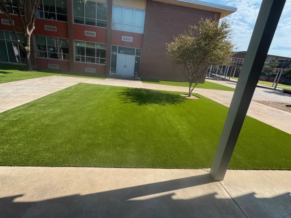 2,500 sq ft synthetic turf lawn installed by Barefoot at a college campus in Denison, TX