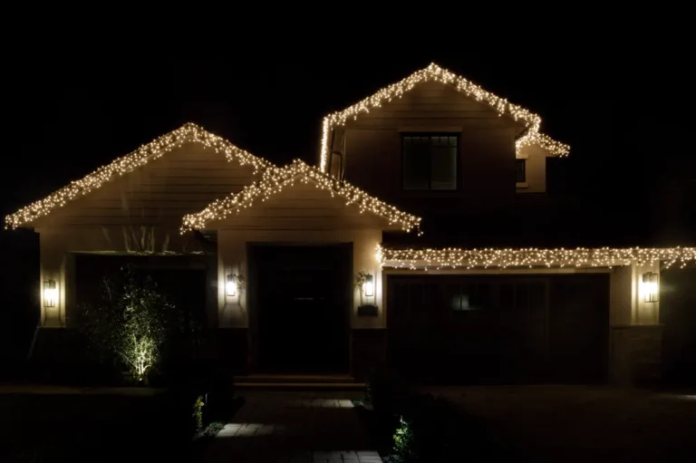 New Christmas light installation — icicle lights following every roofline of a two-story house