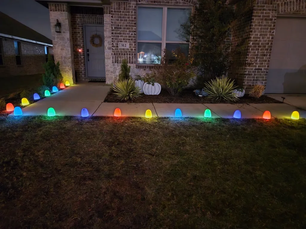 Multicolor C9 pathway and border lights installed by Barefoot along a front walkway in North Texas